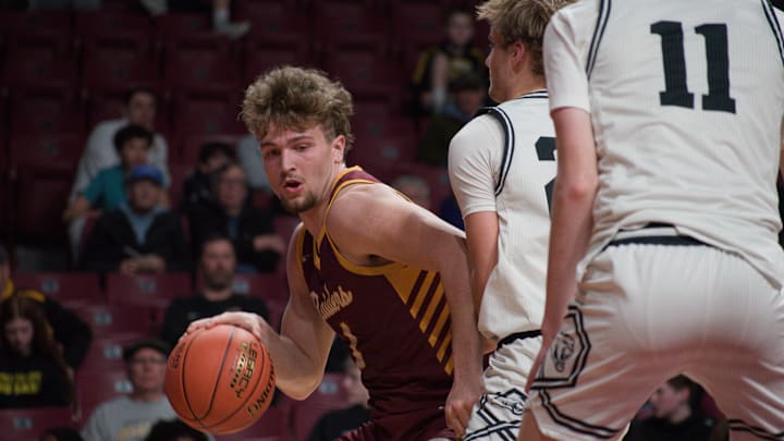 Northfield senior Kayden Oakland drives by Mankato East defenders in the 2026 MSHSL Class 3A quarterfinal at Williams Arena. Northfield won 56-49.