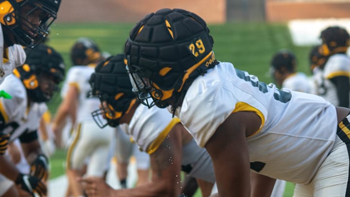 Aug. 17, 2024; Columbia, Missouri, USA; Defensive linemen for the Missouri Tigers prepare to clash with the offensive linemen during warm ups at the team's annual fan night practice at Faurot Field. 