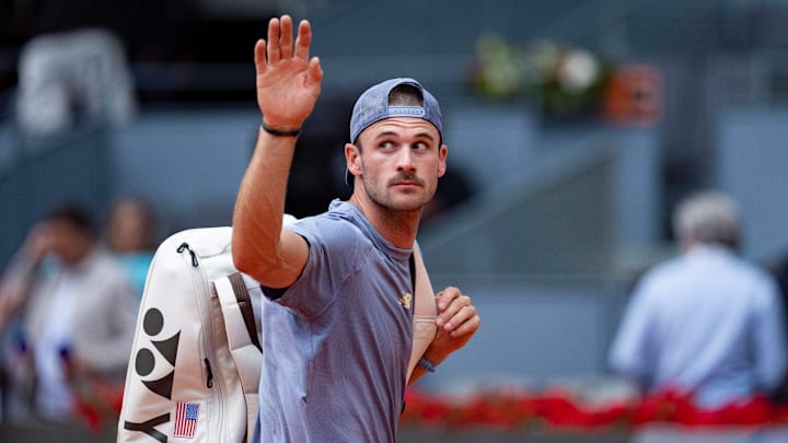 Tommy Paul exits the court after losing to Jack Draper in Madrid.
