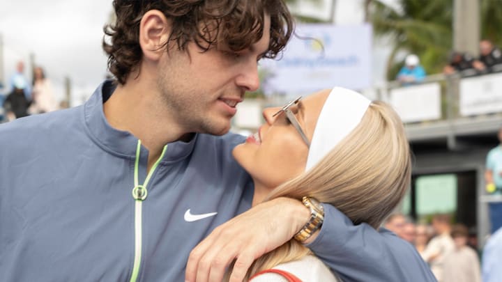 February 19, 2024: Morgan Riddle poses with Taylor Fritz (USA) after he wins the 2024 Delray Beach Open at the Delray Beach Tennis Center in Delray Beach, Florida.