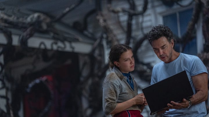STRANGER THINGS: SEASON 5. (L to R) Millie Bobby Brown as Eleven and Executive Producer Shawn Levy behind the scenes of Stranger Things: Season 5. Cr. Niko Tavernise/Netflix © 2024 STRANGER THINGS: SEASON 5. (L to R) Millie Bobby Brown as Eleven and Executive Producer Shawn Levy behind the scenes of Stranger Things: Season 5. Cr. Niko Tavernise/Netflix © 2024
