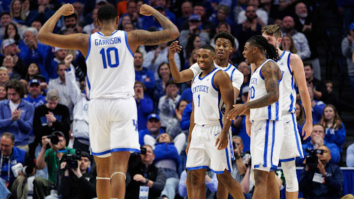 Jan 4, 2025; Lexington, Kentucky, USA; Kentucky Wildcats forward Brandon Garrison (10) celebrates after guard Lamont Butler (1) scores a basket and is fouled during the first half against the Florida Gatorsat Rupp Arena at Central Bank Center. Mandatory Credit: Jordan Prather-Imagn Images