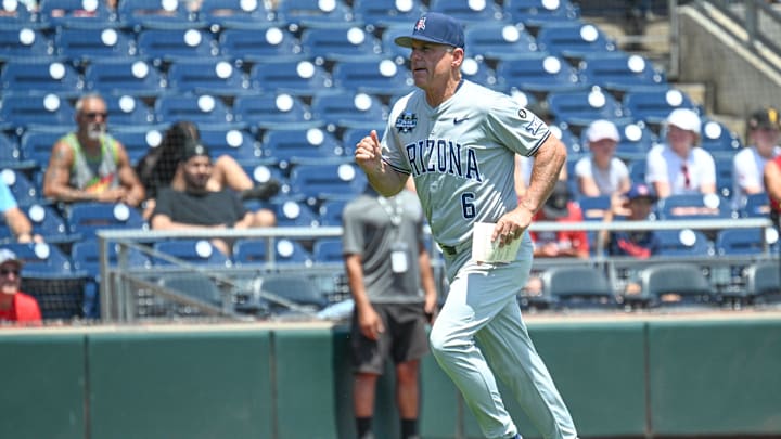 Jun 15, 2025; Omaha, Neb, USA;  Arizona Wildcats head coach Chip Hale (6) runs to the dugout before the game against the Louisville Cardinals at Charles Schwab Field. Mandatory Credit: Steven Branscombe-Imagn Images