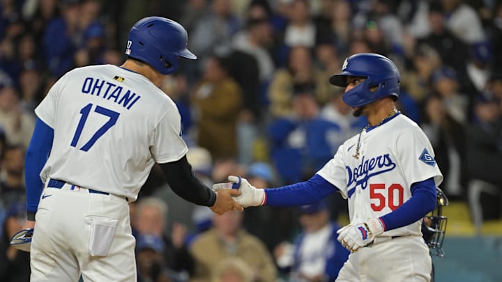Apr 1, 2025; Los Angeles, California, USA;  Los Angeles Dodgers shortstop Mookie Betts (50) shakes hands with designated hitter Shohei Ohtani (17) after hitting a two run home run in the sixth inning against the Atlanta Braves at Dodger Stadium. Mandatory Credit: Jayne Kamin-Oncea-Imagn Images