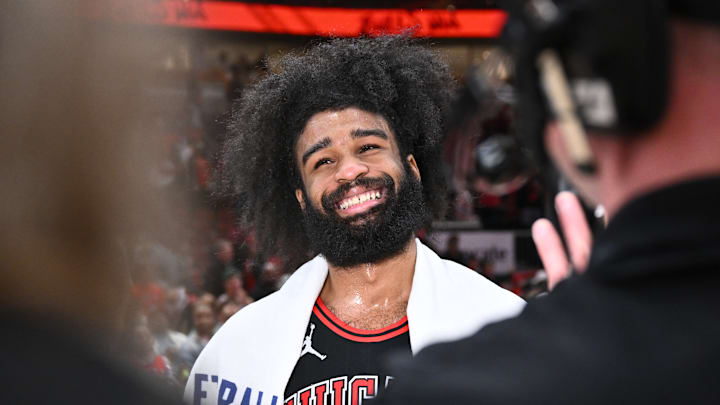 Chicago Bulls guard Coby White smiles during a postgame interview after a Play-In Tournament game against the Atlanta Hawks.