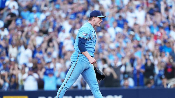 Aug 15, 2026; Toronto, Ontario, CAN; Toronto Blue Jays relief pitcher Louis Varland (77) celebrates the win against the New York Yankees at the end of the ninth inning at Rogers Centre. Mandatory Credit: Nick Turchiaro-Imagn Images