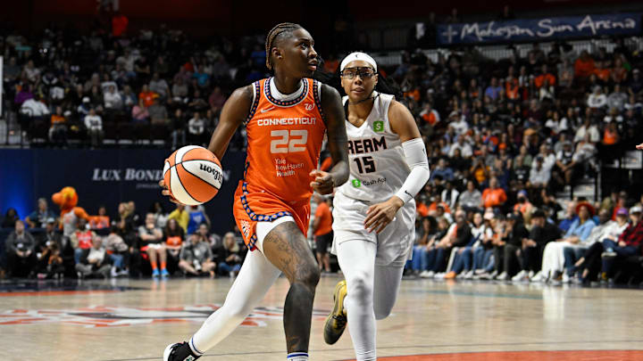 Sep 10, 2025; Uncasville, Connecticut, USA; Connecticut Sun guard Saniya Rivers (22) drives to the basket against Atlanta Dream guard Allisha Gray (15) during the second half at Mohegan Sun Arena. 