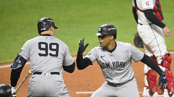 New York Yankees outfielder Juan Soto (22) celebrates after hitting a two run home run with outfielder Aaron Judge (99) in the first inning against the Cleveland Guardians during game four of the ALCS for the 2024 MLB playoffs at Progressive Field on Oct 18.