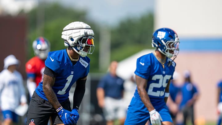 New York Giants wide receiver Malik Nabers (1) and New York Giants running back Tyrone Tracy Jr. (29)  