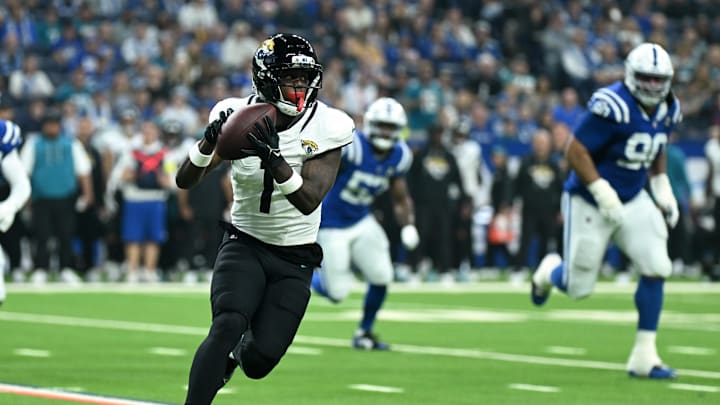 Dec 28, 2025; Indianapolis, Indiana, USA; Jacksonville Jaguars running back Travis Etienne Jr. (1) runs during the first half against the Indianapolis Colts at Lucas Oil Stadium. Mandatory Credit: Robert Goddin-Imagn Images