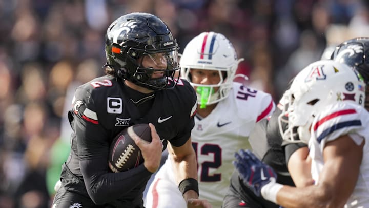 Nov 15, 2025; Cincinnati, Ohio, USA;  Cincinnati Bearcats quarterback Brendan Sorsby (2) runs with the ball against the Arizona Wildcats in the second half at Nippert Stadium. Mandatory Credit: Aaron Doster-Imagn Images