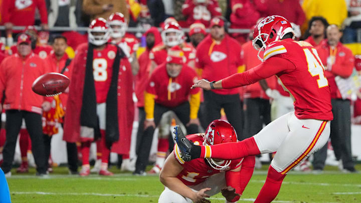 Dec 8, 2024; Kansas City, Missouri, USA; Kansas City Chiefs place kicker Matthew Wright (49) kicks the winning field goal against the Los Angeles Chargers during the second half at GEHA Field at Arrowhead Stadium. Mandatory Credit: Denny Medley-Imagn Images