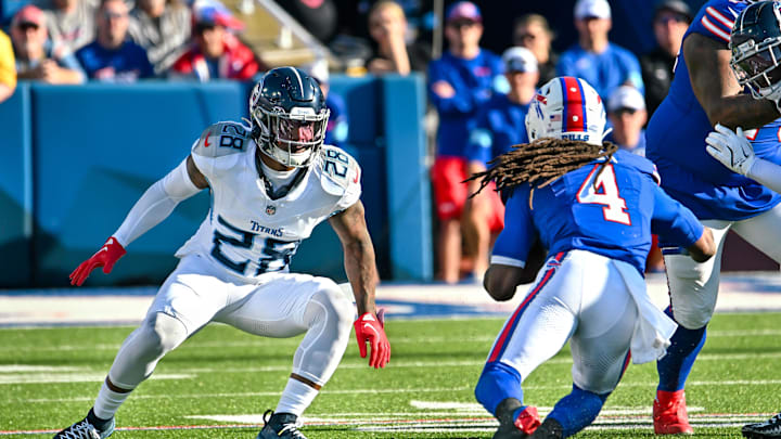 Oct 20, 2024; Orchard Park, New York, USA; Tennessee Titans safety Quandre Diggs (28) looks to make a tackle on Buffalo Bills running back James Cook (4) in the fourth quarter at Highmark Stadium. Mandatory Credit: Mark Konezny-Imagn Images Oct 20, 2024; Orchard Park, New York, USA; Tennessee Titans safety Quandre Diggs (28) looks to make a tackle on Buffalo Bills running back James Cook (4) in the fourth quarter at Highmark Stadium. Mandatory Credit: Mark Konezny-Imagn Images
