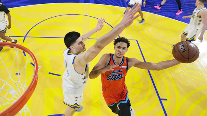 February 14, 2025; San Francisco, California, USA; Team T forward Zaccharie Risacher (10) of the Atlanta Hawks shoots the ball against Team C forward Zach Edey (14) of the Memphis Grizzlies during the 2025 NBA Rising Stars Game at Chase Center. Mandatory Credit: Kyle Terada-Imagn Images February 14, 2025; San Francisco, California, USA; Team T forward Zaccharie Risacher (10) of the Atlanta Hawks shoots the ball against Team C forward Zach Edey (14) of the Memphis Grizzlies during the 2025 NBA Rising Stars Game at Chase Center. Mandatory Credit: Kyle Terada-Imagn Images