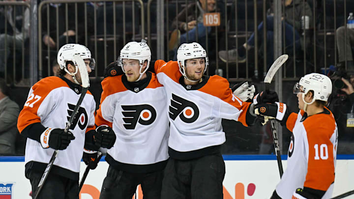 Apr 9, 2025; New York, New York, USA;  Philadelphia Flyers right wing Tyson Foerster (71) celebrates this goal against the New York Rangers with Philadelphia Flyers right wing Bobby Brink (10), Philadelphia Flyers left wing Noah Cates (27) and Philadelphia Flyers defenseman Travis Sanheim (6) during the third period at Madison Square Garden.