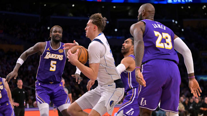 Nov 28, 2025; Los Angeles, California, USA; Dallas Mavericks forward Cooper Flagg (32) drives to the basket through the Los Angeles Lakers defense in the second half at Crypto.com Arena. Mandatory Credit: Jayne Kamin-Oncea-Imagn Images Nov 28, 2025; Los Angeles, California, USA; Dallas Mavericks forward Cooper Flagg (32) drives to the basket through the Los Angeles Lakers defense in the second half at Crypto.com Arena. Mandatory Credit: Jayne Kamin-Oncea-Imagn Images
