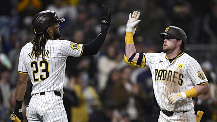Apr 8, 2024; San Diego, California, USA; San Diego Padres first baseman Jake Cronenworth (right) celebrates with right fielder Fernando Tatis Jr. (23) after hitting a two-run home run against the Chicago Cubs during the sixth inning at Petco Park. Mandatory Credit: Orlando Ramirez-Imagn Images