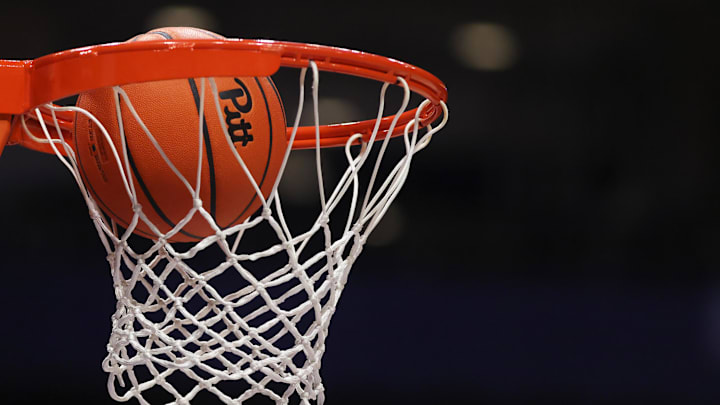 Mar 4, 2026; Pittsburgh, Pennsylvania, USA;  A Pittsburgh Panthers branded game ball goes through the net before the game against the Florida State Seminoles at the Petersen Events Center. Mandatory Credit: Charles LeClaire-Imagn Images