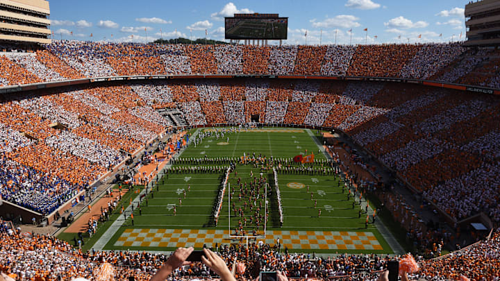 Tennessee players take the field as the University of Tennessee Pride of the Southland marching band performs a pregame show and fans checker Neyland Stadium orange and white for the Florida game on Saturday, Sept. 24, 2016. 