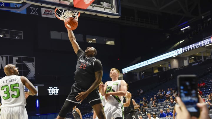Coreonate Deberry slams it at The Basketball Tournament Friday, July 21, 2023, at the Cintas Center. The event featured Nasty 'Nati, which consisted of UC alumni, and Zip'em Up, made up of Xavier alumni.