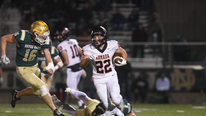 Armada's Jackson Malburg tries to break a tackle during a Division 5 regional final against Pontiac Notre Dame Prep at William Kozyra Alumni Field in Pontiac on Friday, Nov. 15, 2024.