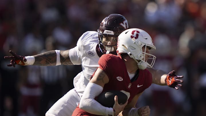 Oct 5, 2024; Stanford, California, USA;  Virginia Tech Hokies defensive lineman Josh Fuga (6) sacks Stanford Cardinal quarterback Justin Lamson (8) during the fourth quarter at Stanford Stadium. Mandatory Credit: Stan Szeto-Imagn Images