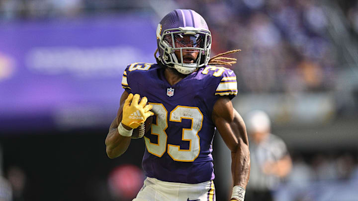 Sep 22, 2024; Minneapolis, Minnesota, USA; Minnesota Vikings running back Aaron Jones (33) in action during the game against the Houston Texans at U.S. Bank Stadium. Mandatory Credit: Jeffrey Becker-Imagn Images