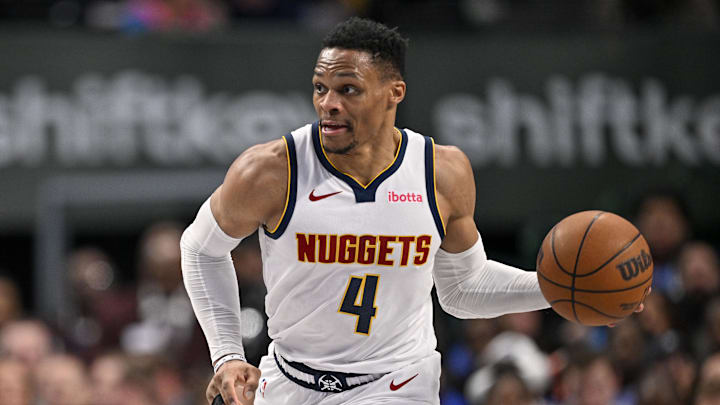Jan 14, 2025; Dallas, Texas, USA; Denver Nuggets guard Russell Westbrook (4) brings the ball up court against the Dallas Mavericks during the second half at the American Airlines Center. Mandatory Credit: Jerome Miron-Imagn Images