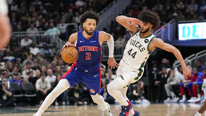 Nov 13, 2024; Milwaukee, Wisconsin, USA;  Detroit Pistons guard Cade Cunningham (2) drives for the basket around Milwaukee Bucks guard Andre Jackson Jr. (44) during the fourth quarter at Fiserv Forum. Mandatory Credit: Jeff Hanisch-Imagn Images