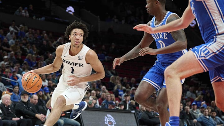 Nov 25, 2022; Portland, Oregon, USA; Duke basketball recruiting target Desmond Claude (1) drives to the basket during the first half against Duke Blue Devils forward Dariq Whitehead (0) at Moda Center.