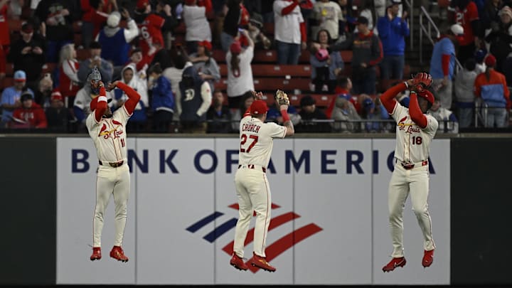 May 2, 2026; St. Louis, Missouri, USA; St. Louis Cardinals center fielder Victor Scott II (11), St. Louis Cardinals left fielder Nathan Church (27) and St. Louis Cardinals right fielder Jordan Walker (18) celebrate after beating the Los Angeles Dodgers at Busch Stadium. Mandatory Credit: Joe Puetz-Imagn Images