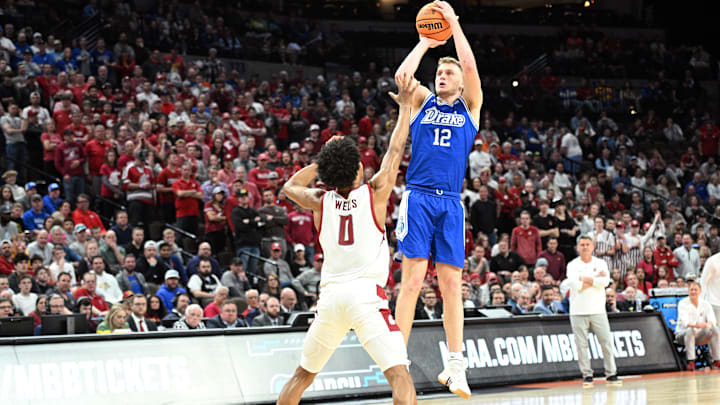 Former Drake Bulldogs guard Tucker DeVries (12) shoots against Washington State Cougars forward Jaylen Wells (0) in the second half in the first round of the 2024 NCAA Tournament at CHI Health Center Omaha.