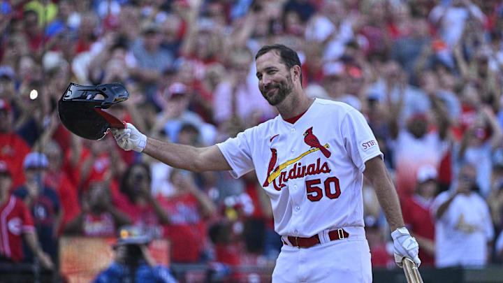 Oct 1, 2023; St. Louis, Missouri, USA;  St. Louis Cardinals pinch hitter Adam Wainwright (50) tips his cap as he receives a standing ovation before his final at bat during the eighth inning against the Cincinnati Reds at Busch Stadium. Mandatory Credit: Jeff Curry-Imagn Images