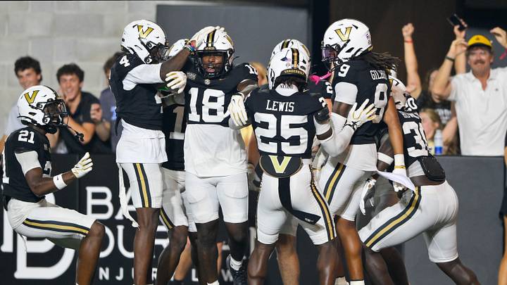 Sep 5, 2026; Nashville, Tennessee, USA; Vanderbilt Commodores linebacker Josiah Broxton (18) celebrates with teammates after returning a muffed punt for a touchdown against Austin Peay Governors punter Logan Leftrick (not pictured) during the second half at FirstBank Stadium. Mandatory Credit: Steve Roberts-Imagn Images Sep 5, 2026; Nashville, Tennessee, USA; Vanderbilt Commodores linebacker Josiah Broxton (18) celebrates with teammates after returning a muffed punt for a touchdown against Austin Peay Governors punter Logan Leftrick (not pictured) during the second half at FirstBank Stadium. Mandatory Credit: Steve Roberts-Imagn Images