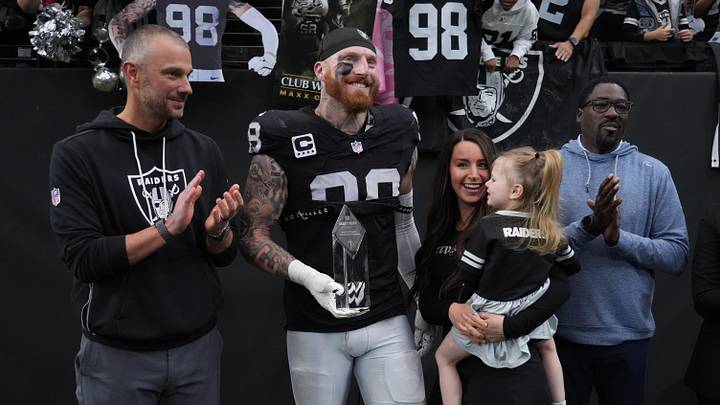 Las Vegas Raiders defensive end Maxx Crosby and Raiders general manager John Spytek.