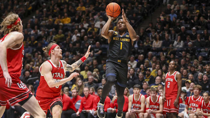 Feb 8, 2025; Morgantown, West Virginia, USA; West Virginia Mountaineers guard Joseph Yesufu (1) shoots over Utah Utes guard Gabe Madsen (55) during the first half at WVU Coliseum. Mandatory Credit: Ben Queen-Imagn Images Feb 8, 2025; Morgantown, West Virginia, USA; West Virginia Mountaineers guard Joseph Yesufu (1) shoots over Utah Utes guard Gabe Madsen (55) during the first half at WVU Coliseum. Mandatory Credit: Ben Queen-Imagn Images