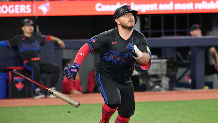 Toronto Blue Jays designated hitter Alejandro Kirk (30) hits a two RBI single against the Boston Red Sox in the fifth inning at Rogers Centre in 2024. Toronto Blue Jays designated hitter Alejandro Kirk (30) hits a two RBI single against the Boston Red Sox in the fifth inning at Rogers Centre in 2024.