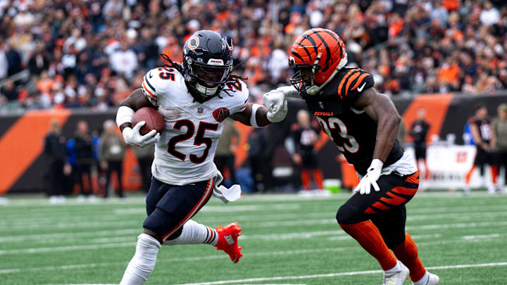 Chicago Bears running back Kyle Monangai (25) stiff arms Cincinnati Bengals cornerback Dax Hill (23) in the second quarter of the NFL football game between Chicago Bears and Cincinnati Bengals at Paycor Stadium in Cincinnati on Nov. 2, 2025.