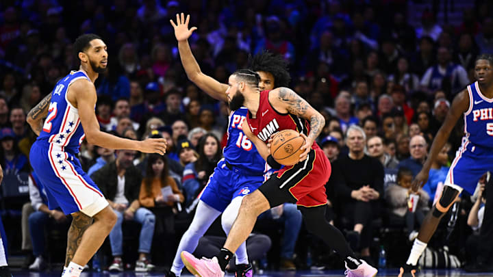 Feb 14, 2024; Philadelphia, Pennsylvania, USA; Miami Heat forward Caleb Martin (16) controls the ball against Philadelphia 76ers guard Ricky Council IV (16) in the third quarter at Wells Fargo Center. Mandatory Credit: Kyle Ross-USA TODAY Sports