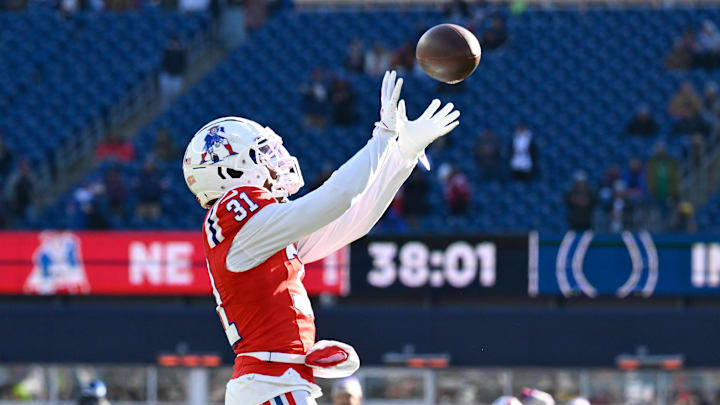 Dec 1, 2024; Foxborough, Massachusetts, USA; New England Patriots cornerback Jonathan Jones (31) warms up before a game against the Indianapolis Colts at Gillette Stadium. Mandatory Credit: Eric Canha-Imagn Images