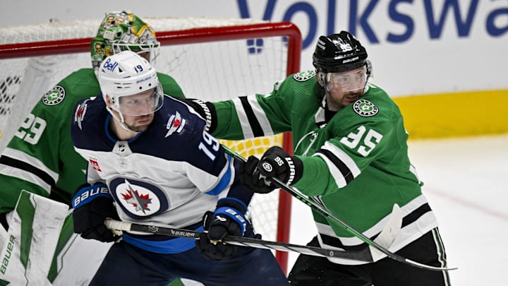 Apr 11, 2024; Dallas, Texas, USA; Dallas Stars center Matt Duchene (95) checks Winnipeg Jets center David Gustafsson (19) during the second period at the American Airlines Center. Mandatory Credit: Jerome Miron-Imagn Images
