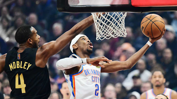 Jan 19, 2026; Cleveland, Ohio, USA; Oklahoma City Thunder guard Shai Gilgeous-Alexander (2) drives to the basket against Cleveland Cavaliers center Evan Mobley (4) during the first quarter at Rocket Arena. Mandatory Credit: Ken Blaze-Imagn Images Jan 19, 2026; Cleveland, Ohio, USA; Oklahoma City Thunder guard Shai Gilgeous-Alexander (2) drives to the basket against Cleveland Cavaliers center Evan Mobley (4) during the first quarter at Rocket Arena. Mandatory Credit: Ken Blaze-Imagn Images