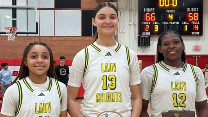 From L-R, Ontario Christian sophomore Kaleena Smith and freshemen Sydney Douglas and Tati Griffin hold up hardware for earning All-Tournament honors at the Troy Classic. Griffin was tournament MVP. 