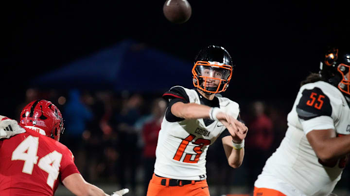 Cocoa High quarterback Brady Hart (#13) releases a pass. Cocoa High School defeated Cardinal Mooney Catholic High School 31-21 to win the Class 2A semi-final game Friday night in Sarasota.
