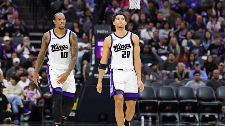 Oct 13, 2024; Sacramento, California, USA; Sacramento Kings forward DeMar DeRozan (10) and guard Colby Jones (20) walk up the court during the fourth quarter against the Portland Trail Blazers at Golden 1 Center. Mandatory Credit: Sergio Estrada-Imagn Images