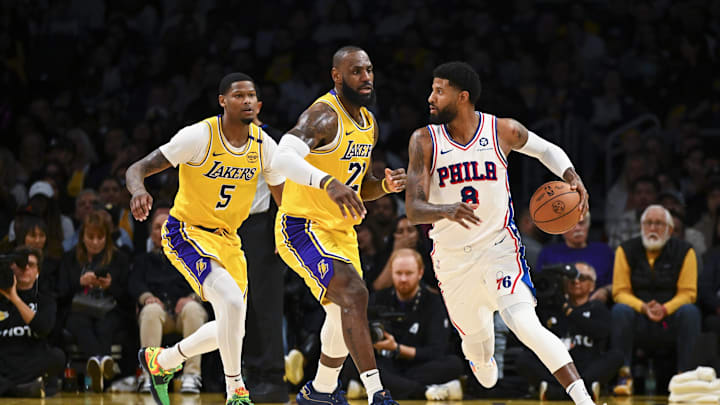 Nov 8, 2024; Los Angeles, California, USA; Philadelphia 76ers forward Paul George (8) looks to pass against Los Angeles Lakers forward LeBron James (23) and forward Cam Reddish (5) during the second half at Crypto.com Arena. Mandatory Credit: Jonathan Hui-Imagn Images Nov 8, 2024; Los Angeles, California, USA; Philadelphia 76ers forward Paul George (8) looks to pass against Los Angeles Lakers forward LeBron James (23) and forward Cam Reddish (5) during the second half at Crypto.com Arena. Mandatory Credit: Jonathan Hui-Imagn Images