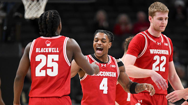 Dec 14, 2024; Indianapolis, Indiana, USA;  Wisconsin Badgers guards John Blackwell (25) and Kamari McGee (4) celebrate after a play during the second half against the Butler Bulldogs at Gainbridge Fieldhouse. Mandatory Credit: Robert Goddin-Imagn Images