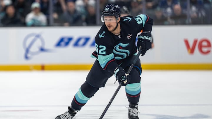 Feb 6, 2025; Seattle, Washington, USA;  Seattle Kraken defenseman Brandon Montour (62) skates with the puck against the Toronto Maple Leafs at Climate Pledge Arena. Mandatory Credit: Stephen Brashear-Imagn Images