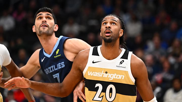 Dec 28, 2025; Washington, District of Columbia, USA; Washington Wizards center Alex Sarr (20) boxes out Memphis Grizzlies forward Santi Aldama (7) during the first half at Capital One Arena. Mandatory Credit: Brad Mills-Imagn Images