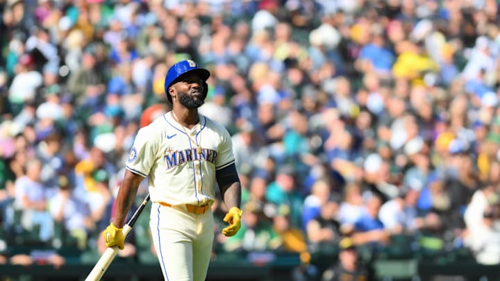 Seattle Mariners left fielder Randy Arozarena (56) walks to first base after being hit by a pitch against the Oakland Athletics during the fifth inning at T-Mobile Park in 2024.